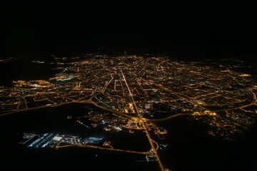 Night view from the window of the plane on takeoff on the city. Saint-Petersburg, Russia. Pulkovo airport.