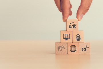 New futuristic technologies for better life. Hand holds wooden cubes with wellbeing symbol standing...