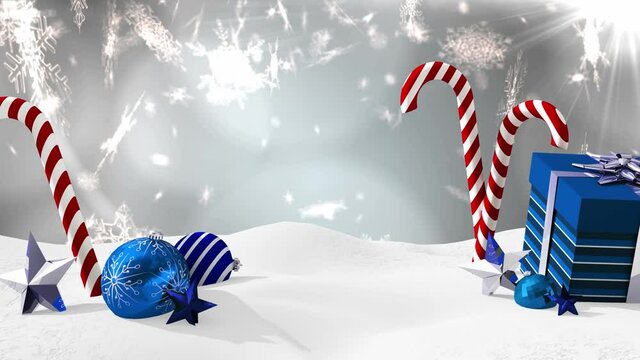 Animation of snow falling over christmas candies and present on grey background