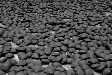 Group of Charcoal briquetts on floor