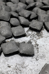Group of Charcoal briquetts on floor