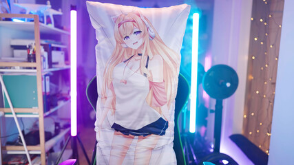 Anime girl dakimakura body pillow on gaming chair surrounded by neon lights and haze