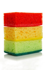Bright multi-colored cleaning sponges. Close-up. Vertical. Isolated on white background.