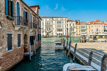 View from the bridge on the Fondamenta della Salute, with boats and view on Canal Grande, Venice, Italy
