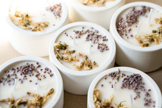 Hand-made concrete candles with dried flowers, scented soy wax vegan candles