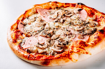 Pizza with Mozzarella cheese, ham, tomato sauce, onion, pepper, mushrooms