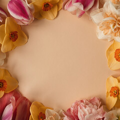 Aesthetic background with colourful flowers. Beautiful floral template composition. Round wreath frame with blank empty copy space mock up background. Flat lay, top view