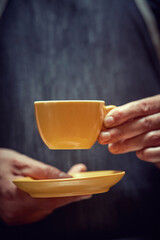 mug of delicious coffee in hand