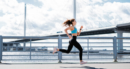 Cardio training for weight loss. Sports and clothing for women. Fitness in the city. The trainer does warm-up exercises before training. The athlete leads a healthy lifestyle.