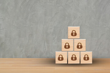 Wooden blocks with padlock icons, Cyber security and data protection. Businessman working computer padlock protecting business and financial data and banking with virtual network connection