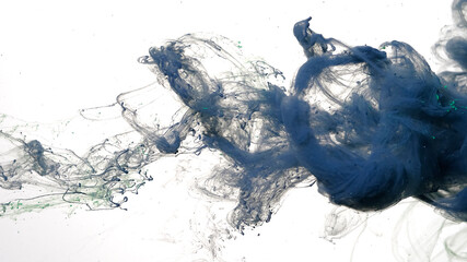Gray-blue watercolor ink in water on a white background. Gray-blue cloud of ink on a white...