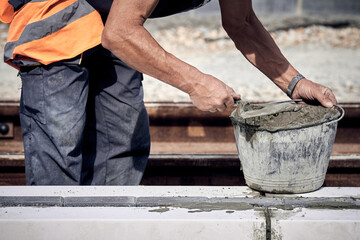 Construction worker working on a public site reconstruction.