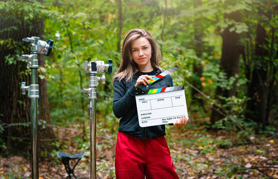 Woman Holding Clapperboard