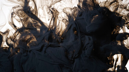 Black watercolor ink in water on a white background. Colored acrylic paints are mixed in water. Awesome abstract background.