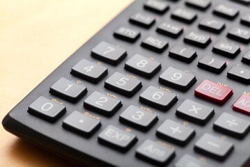 Calculator number buttons, keys macro, object extreme closeup, shallow dof. Learning math, mathematics school education, simple calculations, economy finances and accounting abstract concept nobody