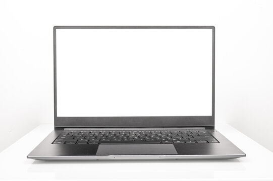 New shiny aluminum laptop with white screen on white background. Silver laptop computer with blank screen on white background