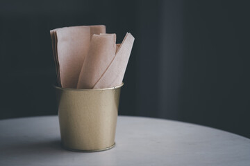 Brown tissue in golden bucket