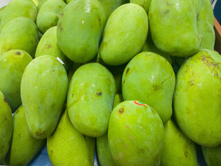 pile of mango fruit that is ready to be sold in the market or in a fruit shop