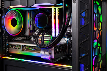 Inside view black high end custom colorful illuminated bright rainbow RGB LED gaming pc. Computer...