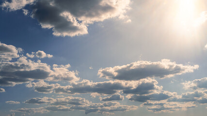Wonderful view of cumulus clouds sky with sun light. Daylight yellow sunshine