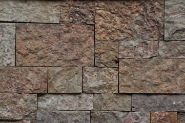 Background, texture of a wall made of large stone blocks. A wall of blocks of different sizes. Background, texture.