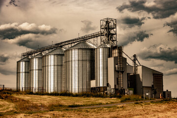 Farm silo for storing cereals in the countryside © milkovasa