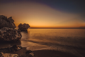 rocky coast of the mediterranean sea at dawn