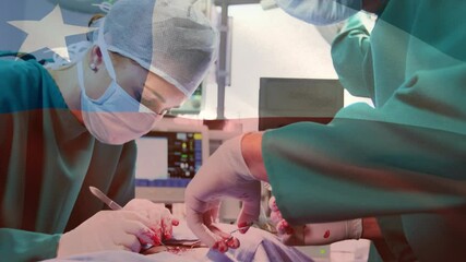 Animation of flag of chile over surgeons in operating theatre - Powered by Adobe