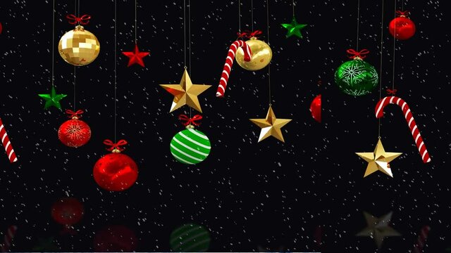Animation of christmas decoration and snow falling on black background