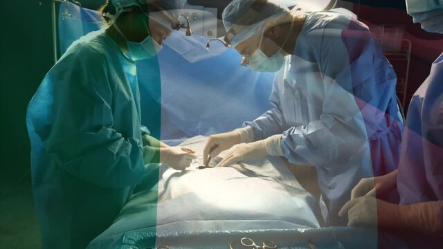 Animation of flag of italy over surgeons in operating theatre