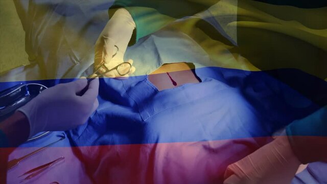 Animation of flag of columbia over surgeons in operating theatre