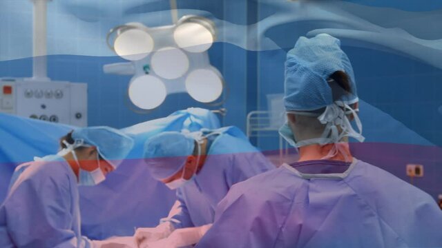 Animation of flag of russia waving over surgeons in operating theatre