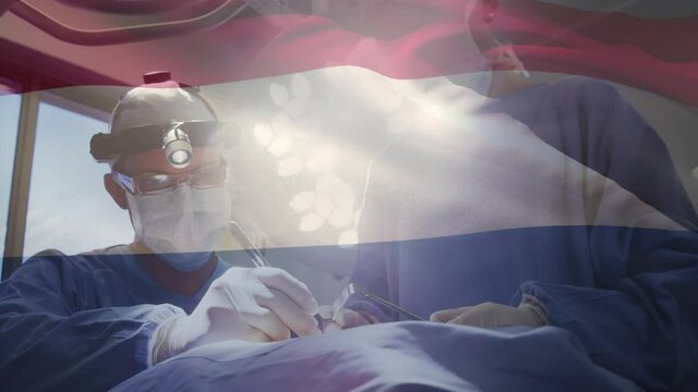 Animation of flag of netherlands waving over surgeons in operating theatre