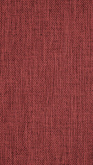 Close-up of dark brown woven surface. Mobile phone wallpaper. The texture is similar to len. Vertical background from fabric. Textured braided red backdrop