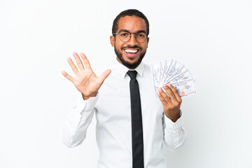 Young business latin man taking a lot of money isolated on white background counting five with fingers