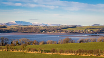 A view of a snow covered Cairnsmore of Fleet overlooking Kirkcudbright Bay
