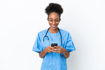 Young surgeon African American doctor woman isolated on white background sending a message with the mobile - Powered by Adobe