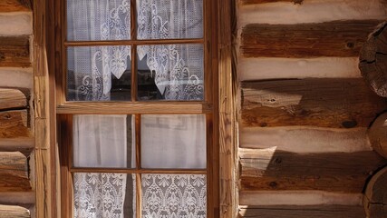 Window of a log cabin in the American west 