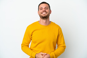 Young Brazilian man isolated on white background laughing