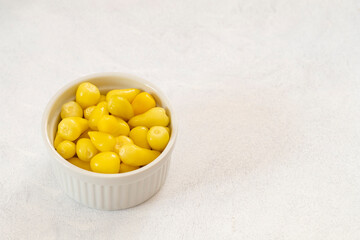 yellow hot pepper pickle on a white background. Copy space