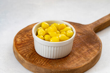 yellow hot pepper pickle on a white background