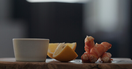crab with dip sauce on olive wood board