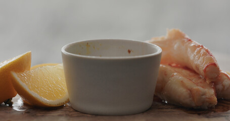 crab with dip sauce on olive wood board