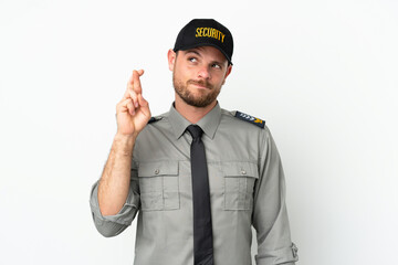 Young security Brazilian man isolated on white background with fingers crossing and wishing the best