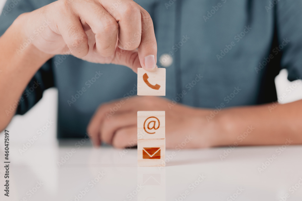 Poster businessman with phone, email, and address on a wooden block cube symbol. contact us page on the web