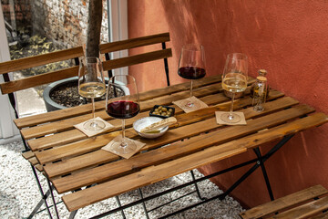 Wine on a wooden table outside