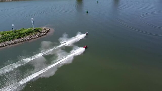 Aerial view of two jet skis moving fast over water it is generically to refer to any type of personal watercraft used mainly for recreation and it is also used to describe the use of any type of PWC