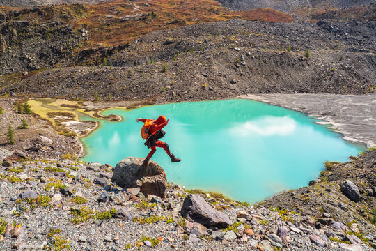 Loss of balance. Tourist is balancing on a rock. Step into the abyss.