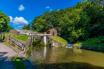 A view on the canal bank looking up the Five Locks network on the Leeds, Liverpool canal at...