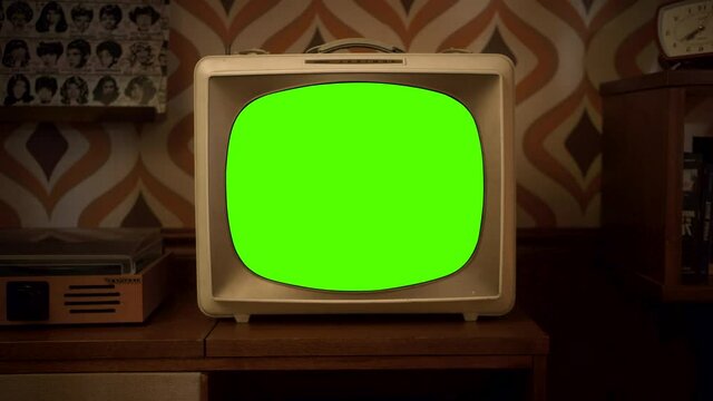 TV screen green screen, Vintage Television Set Green Background with Noise and Static. Zoom Out. You can replace green screen with the footage or picture